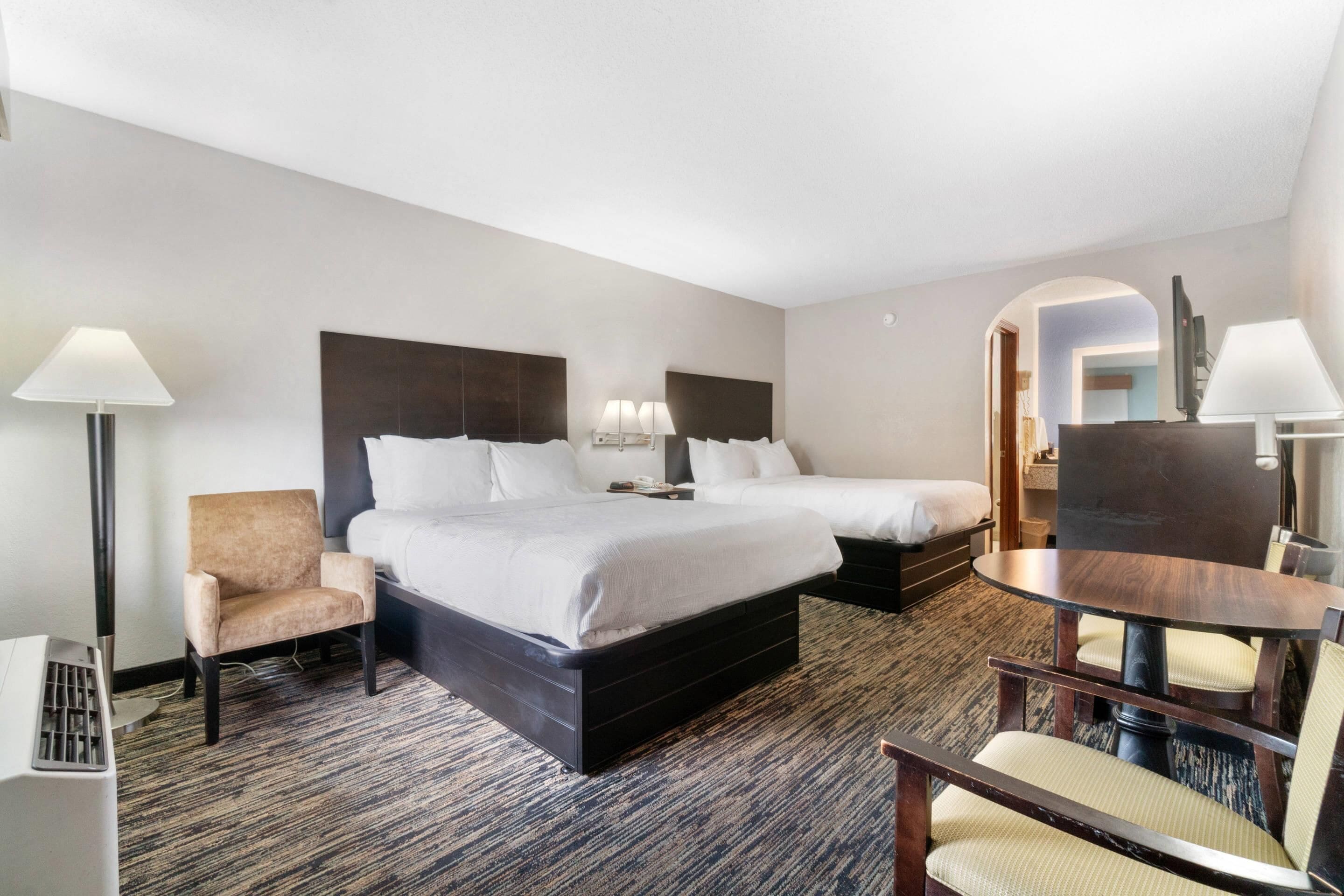 Premium bedding, pillow-top beds, desk, laptop workspace