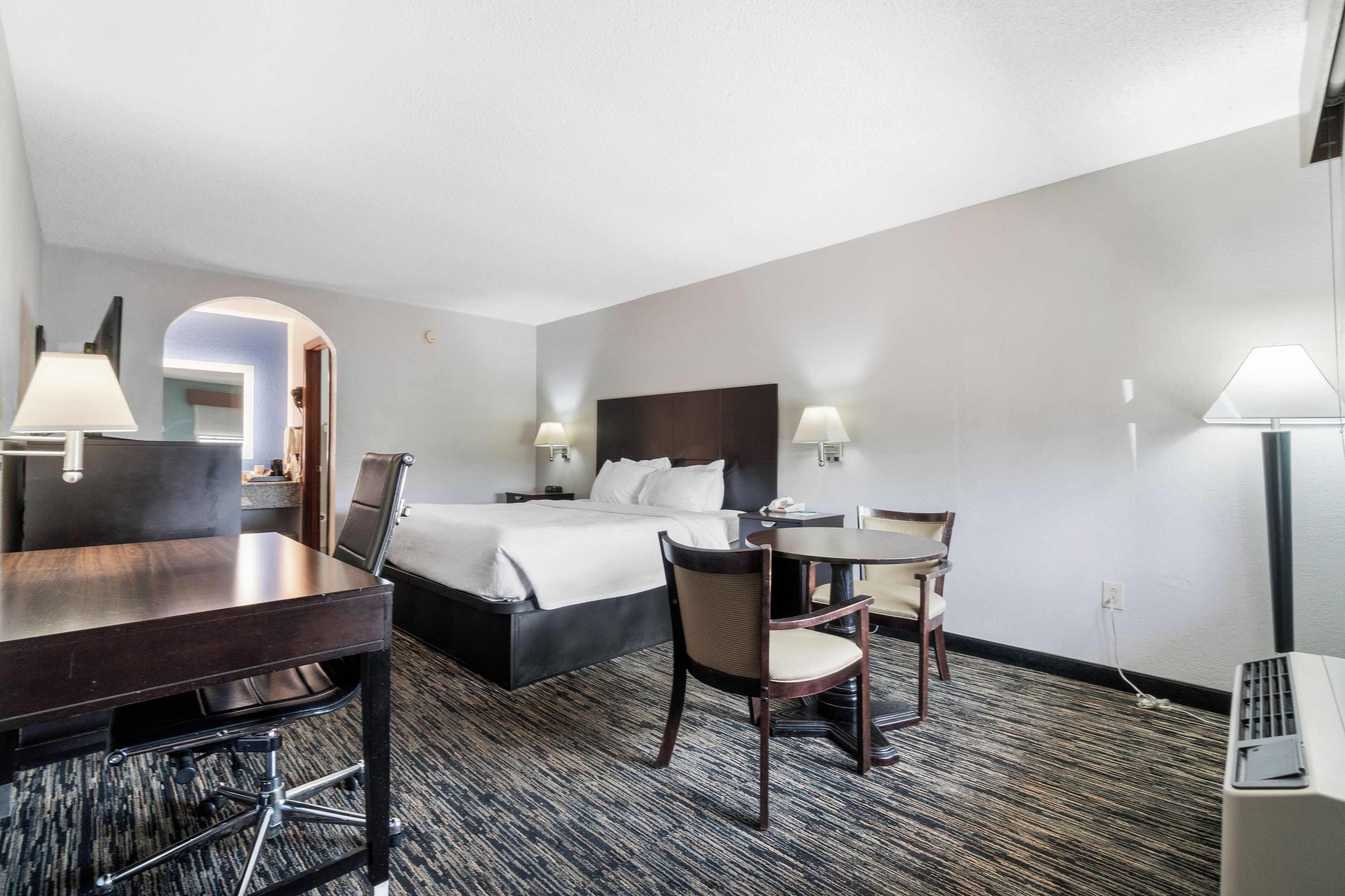 Premium bedding, pillow-top beds, desk, laptop workspace