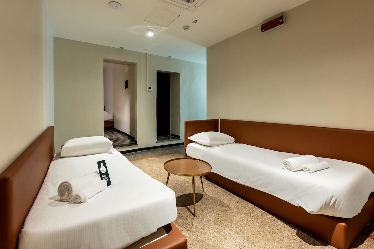 Standard Quadruple Room | In-room safe, desk, laptop workspace, iron/ironing board