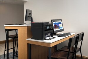 A hotel office desk with a computer, printer, and keyboard. - Holiday Inn Express & Suites College Park-University Area by IHG (College Park)