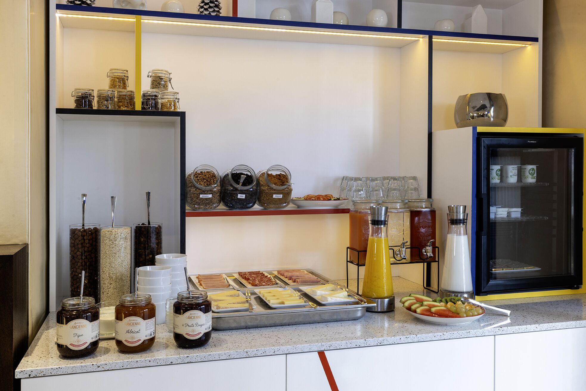 A breakfast buffet with various food items and condiments.