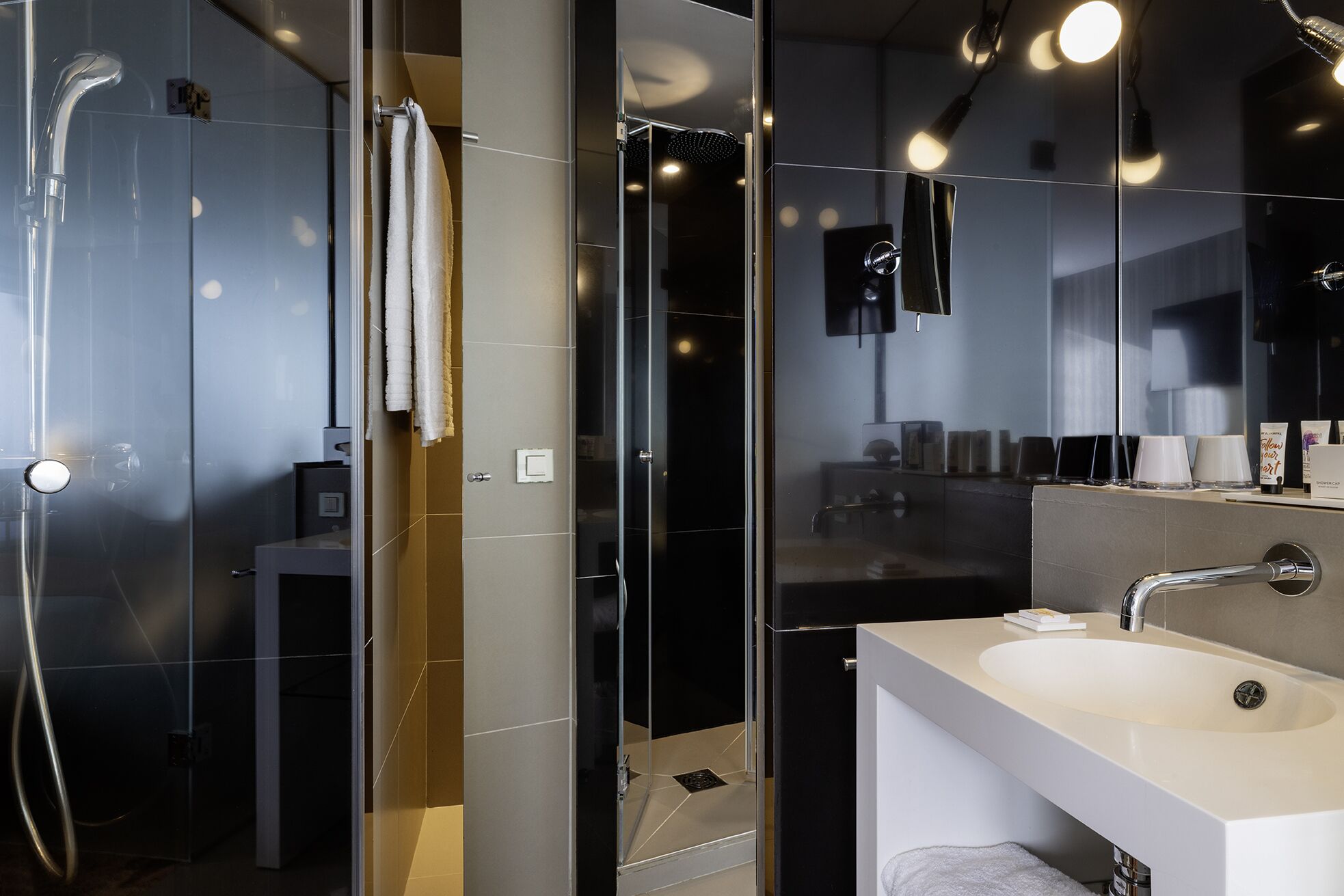 designer toiletries, hair dryer, bathrobes, slippers