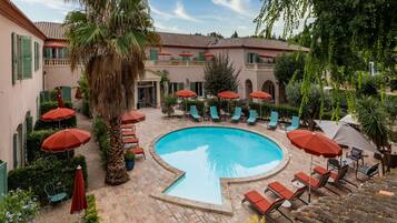 Seasonal outdoor pool, open 10:00 AM to 9:00 PM, pool umbrellas