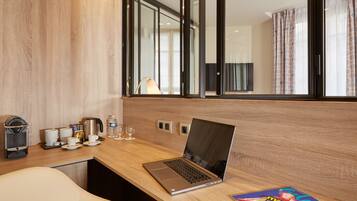 Colchones con pillow-top, minibar y caja de seguridad en la habitación
