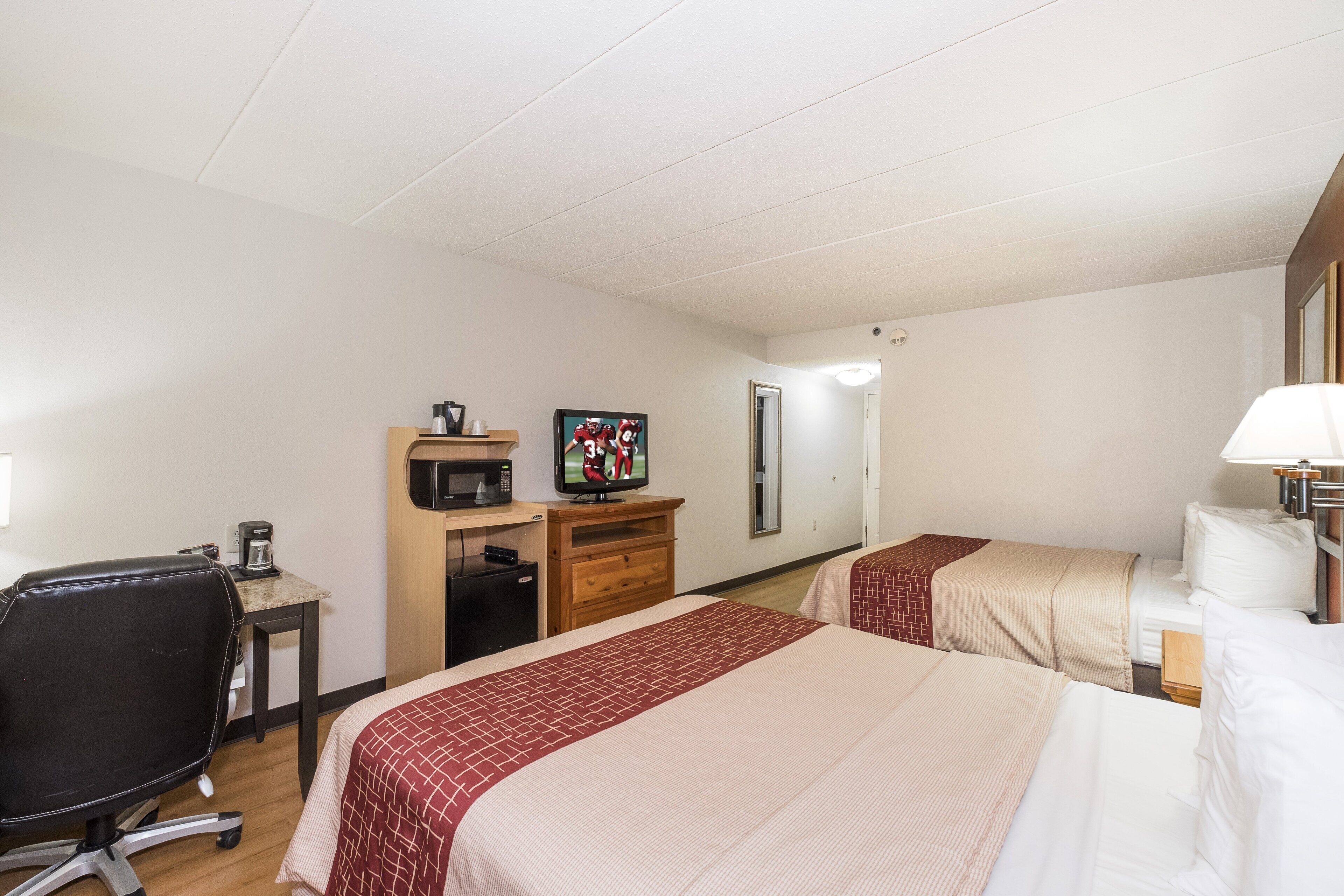 deluxe room, 2 queen beds, non smoking | in-room safe, desk, laptop workspace, blackout curtains