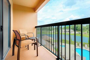 Room, 1 King Bed, Balcony | Desk, blackout drapes, iron/ironing board, free cribs/infant beds