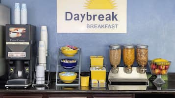 Enjoy a hearty breakfast at the Daybreak Breakfast station, featuring a selection of coffee, cereal, and fresh fruit.