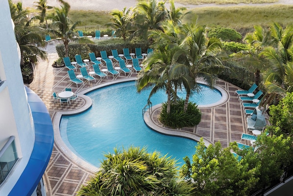 Outdoor pool, open 8:00 AM to 8:00 PM, pool loungers