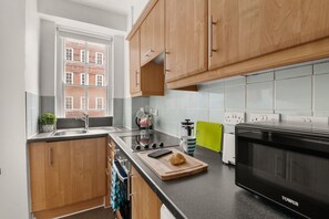 Fridge, microwave, cookware/dishes/utensils