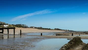 On the beach, sun loungers, beach umbrellas, beach towels