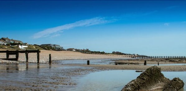 On the beach, sun-loungers, beach umbrellas, beach towels