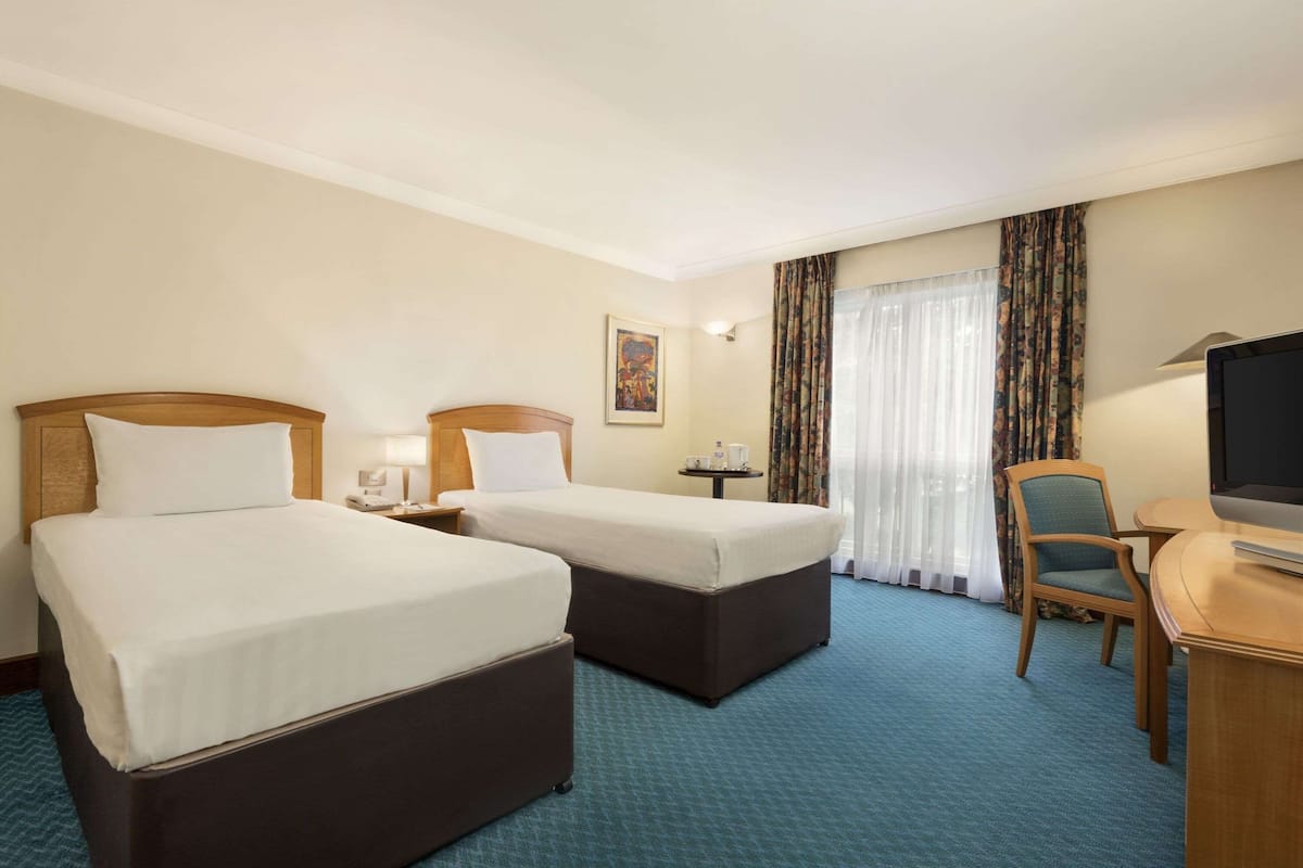 Room, 2 Twin Beds, Non Smoking | In-room safe, desk, iron/ironing board, free cribs/infant beds