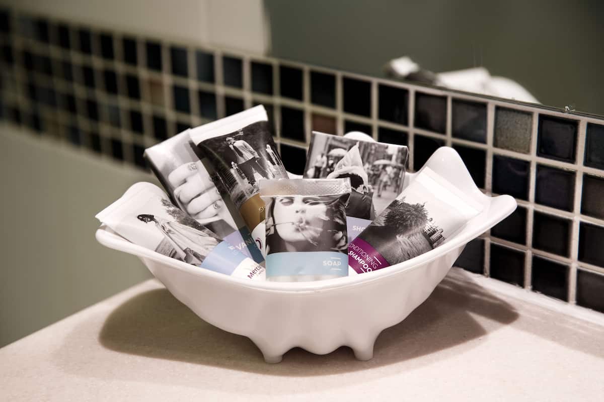 eco-friendly toiletries, hair dryer, towels