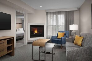 Suite, 2 Double Beds, Fireplace | Living area | 50-inch Smart TV with satellite channels, streaming services