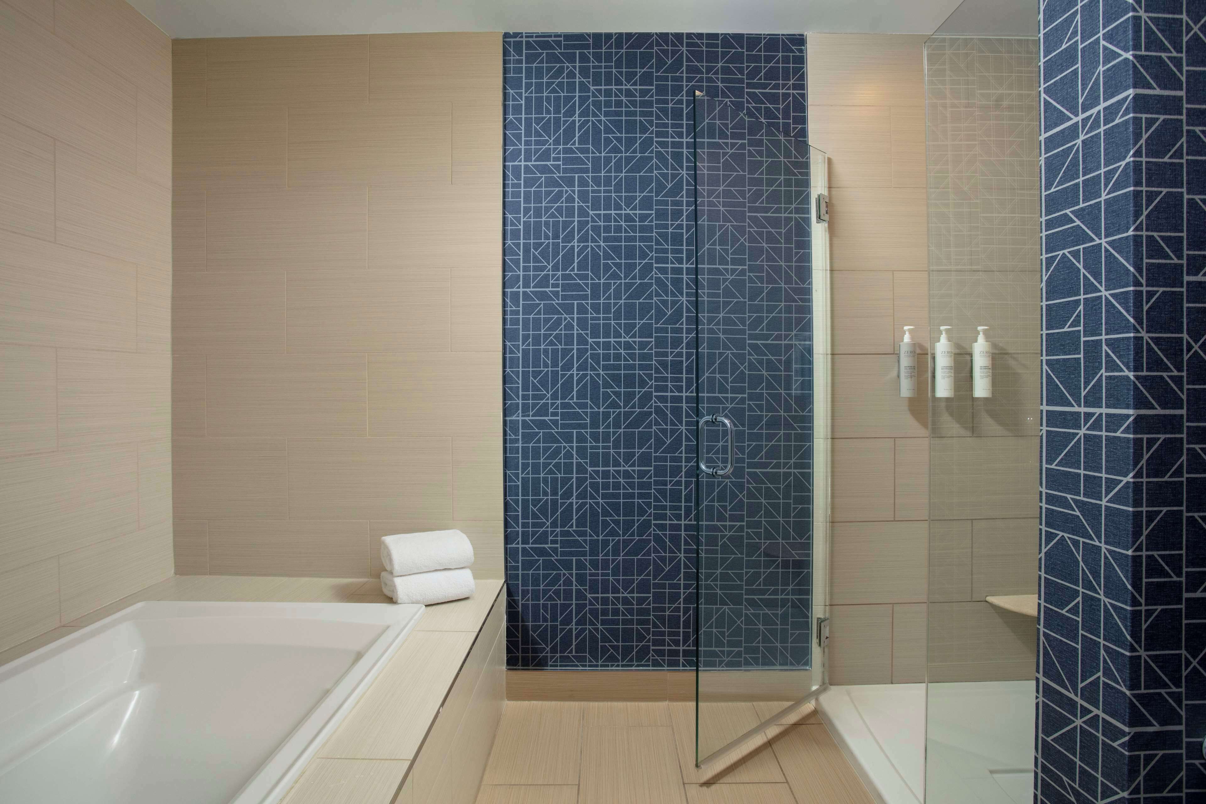 suite, 1 king bed, bathtub | bathroom | combined shower/bathtub, hair dryer, towels