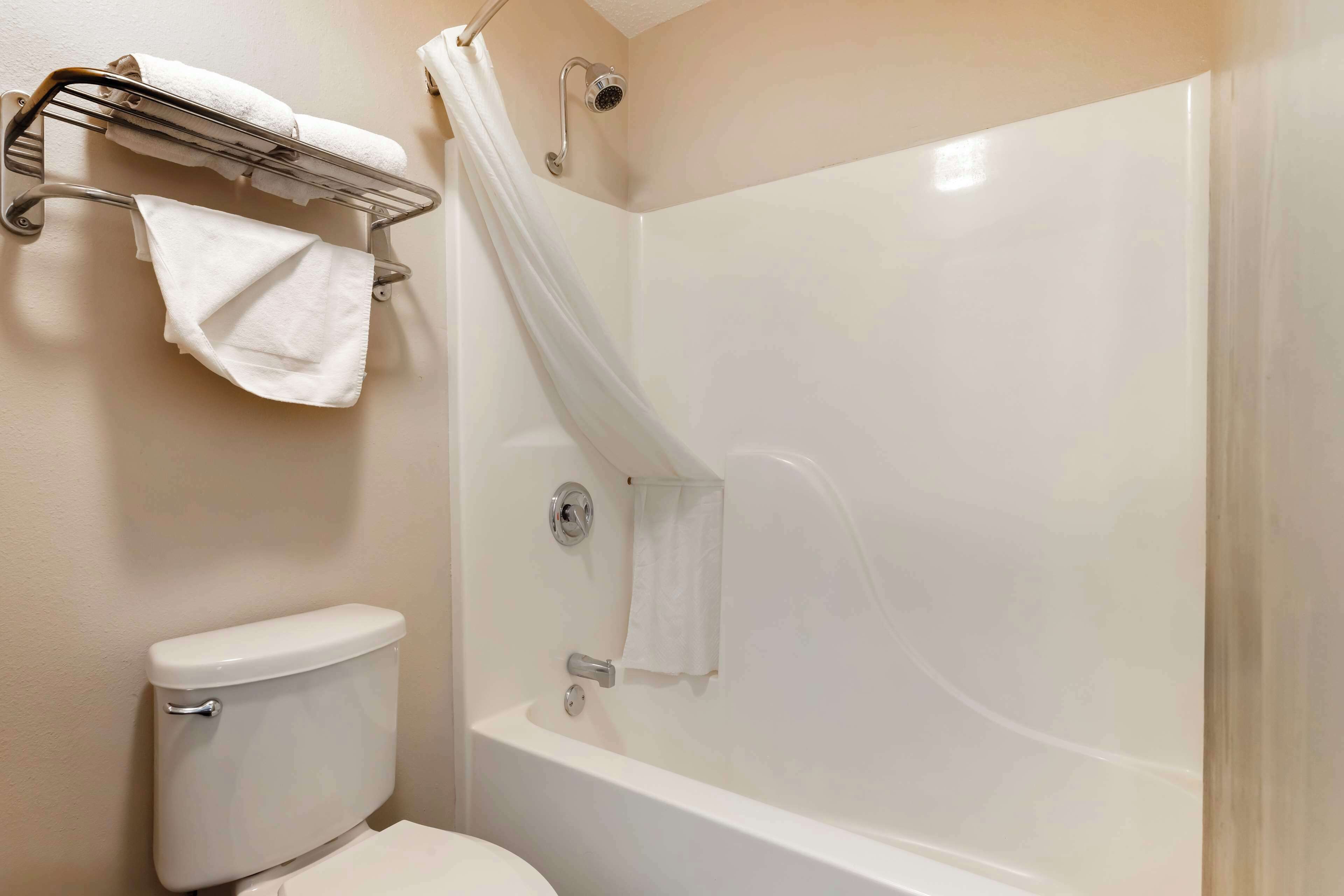 standard room, 2 queen beds, non smoking, refrigerator & microwave | bathroom | combined shower/bathtub, free toiletries, hair dryer, towels