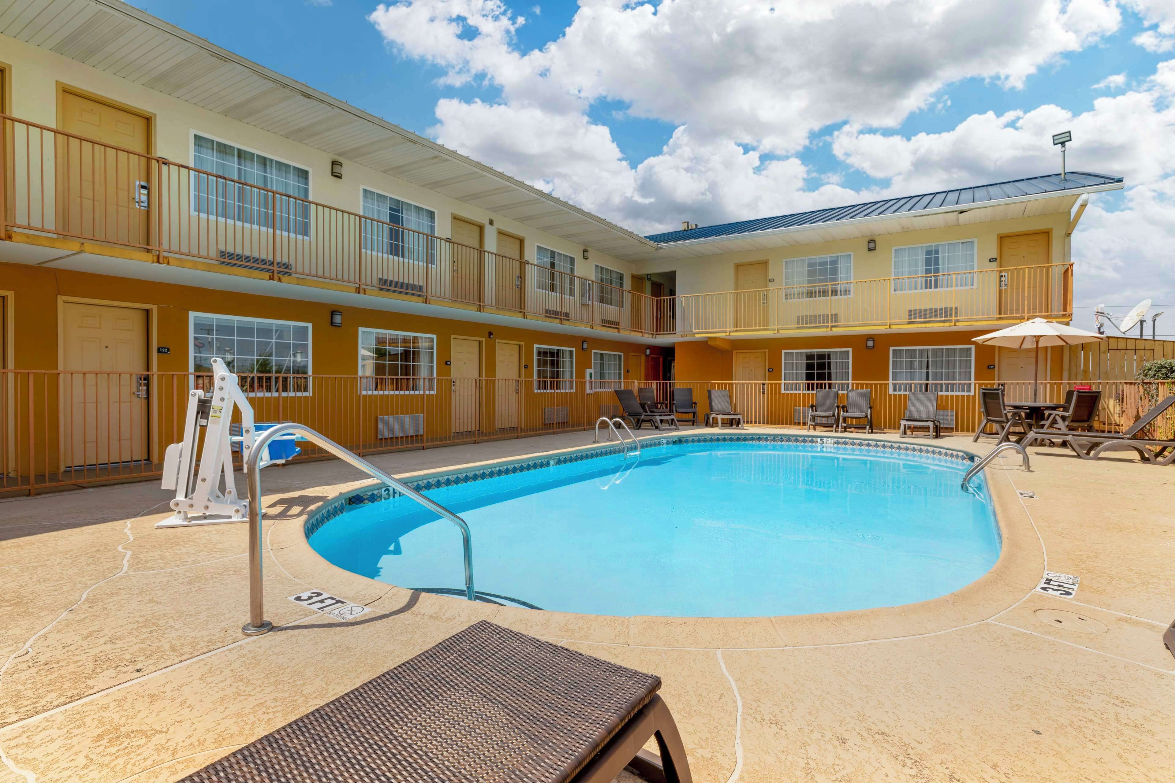 seasonal outdoor pool, open 7 am to 9 pm, pool loungers