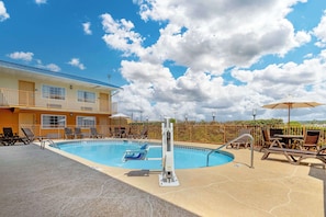 Seasonal outdoor pool, open 7 AM to 9 PM, pool loungers