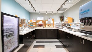 A modern kitchen with a counter displaying fresh produce and a coffee machine. - Holiday Inn Express Atlanta-Stone Mountain by IHG (Stone Mountain)