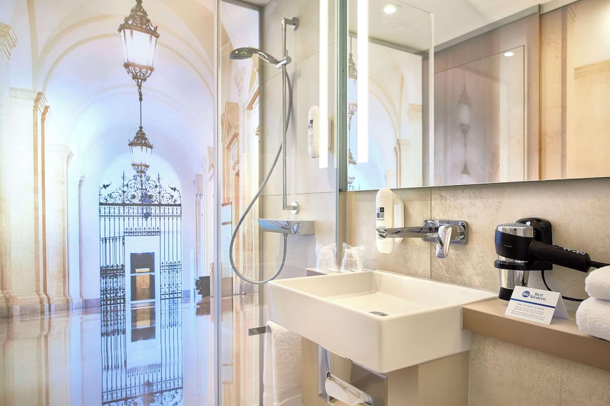 Eco-friendly toiletries, hair dryer, towels