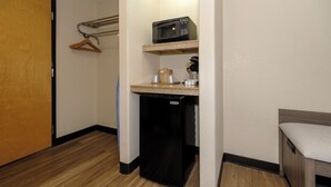 A compact kitchenette with a microwave, coffee maker, and a small refrigerator. - Red Roof Inn Yemassee (Yemassee)