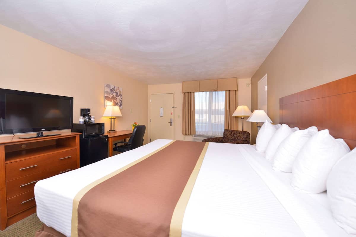 Premium bedding, pillow-top beds, desk, laptop workspace