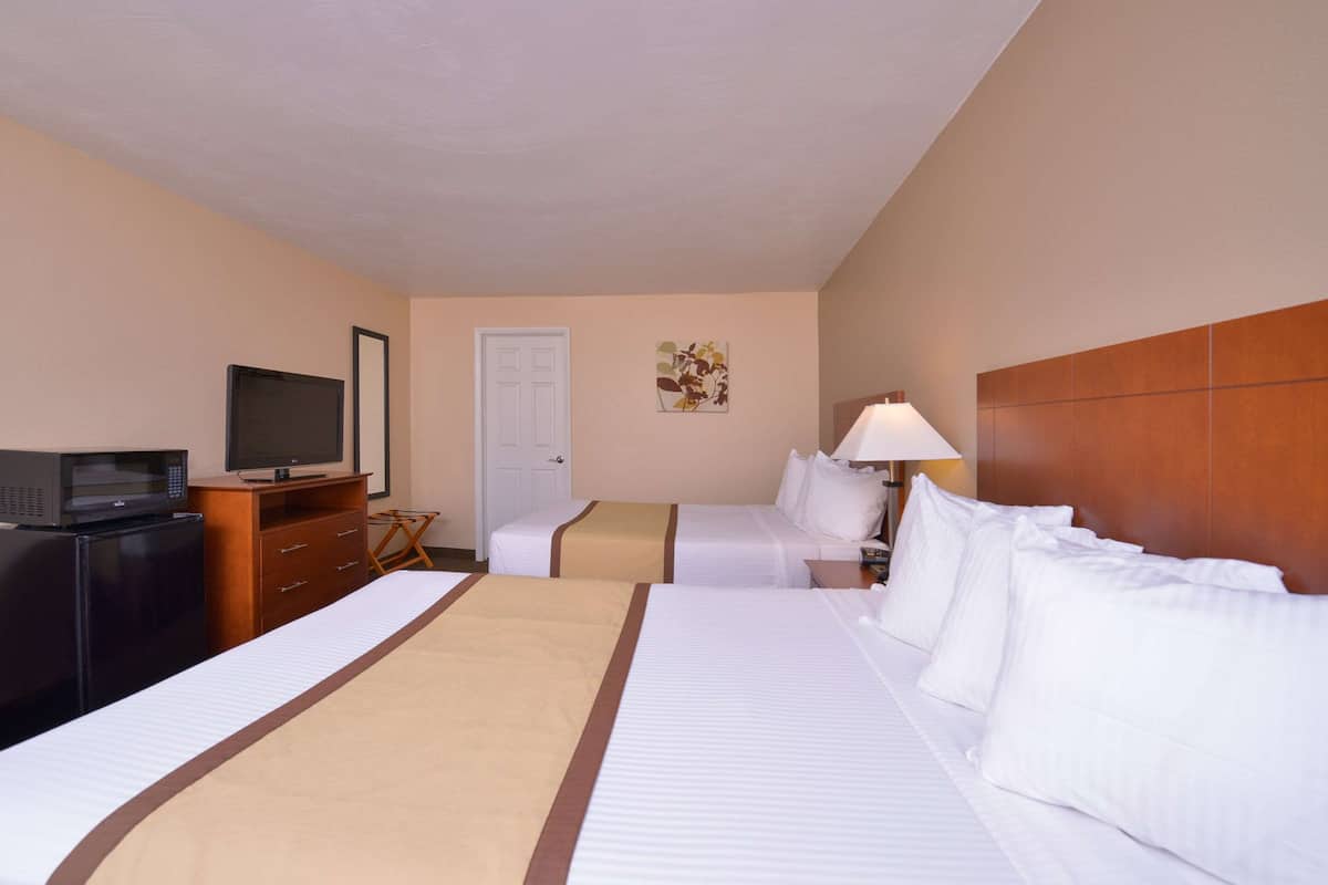 Premium bedding, pillow-top beds, desk, laptop workspace
