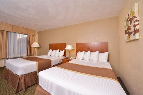 Premium bedding, pillow-top beds, desk, laptop workspace