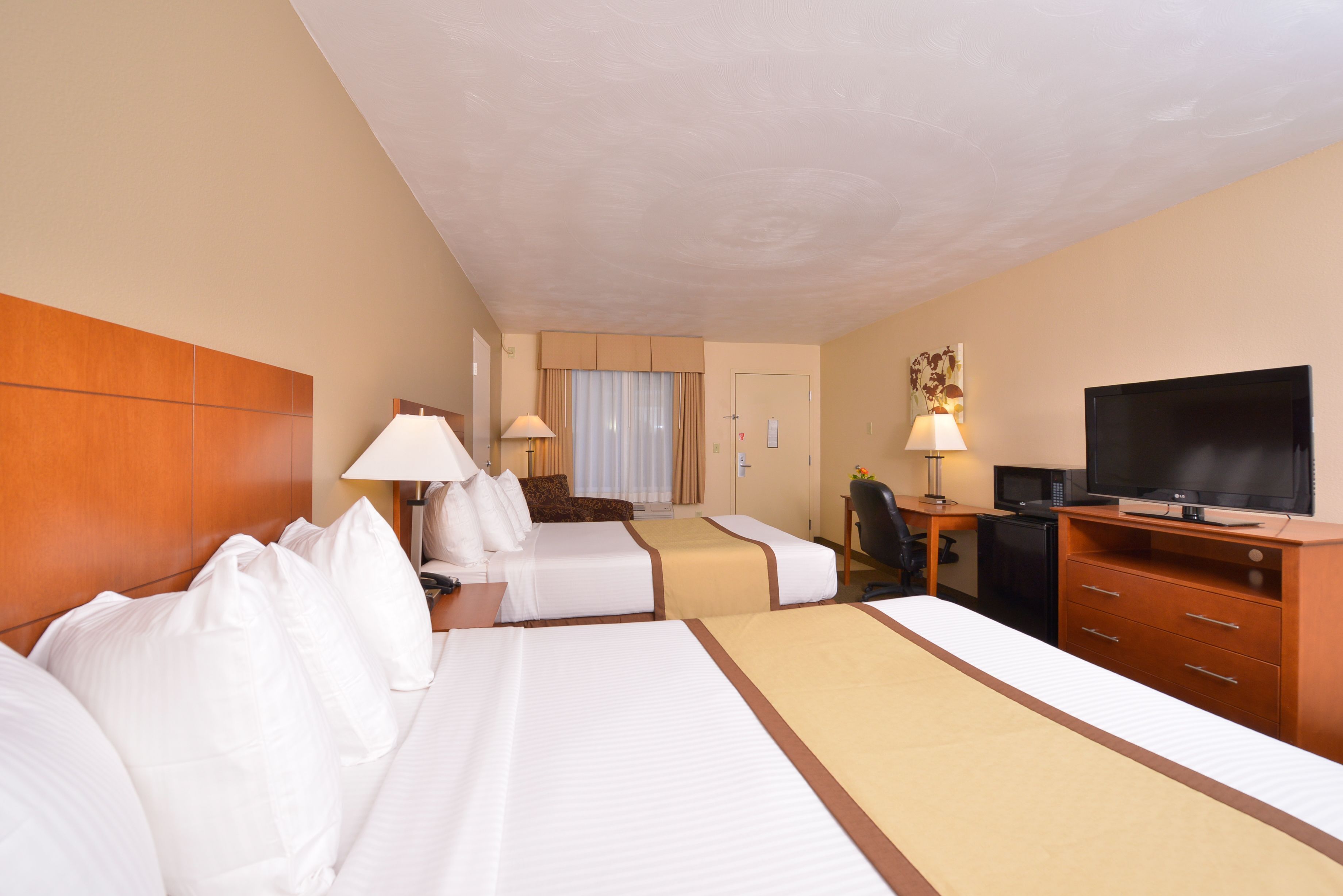 Premium bedding, pillowtop beds, desk, laptop workspace