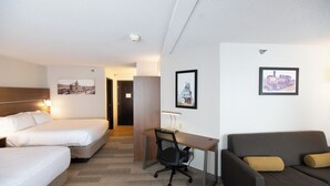 A hotel room with two beds, a desk, a chair, and a sofa. - Holiday Inn Express Houghton-Keweenaw by IHG (Houghton)