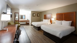 A hotel room with two beds, a wooden desk, a chair, a mirror, and a window. - The Hotel Serene Glendale Peoria, Surestay Collection by BW (Glendale)