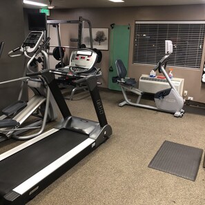 Stay active with our fully equipped gym featuring treadmills, ellipticals, and weight machines.