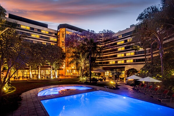 Outdoor pool, pool umbrellas, sun loungers