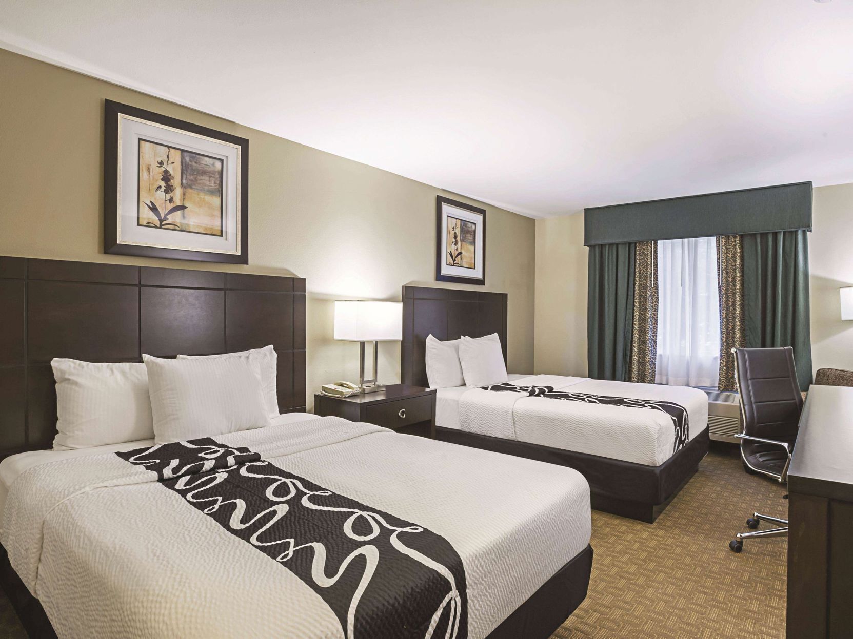 Premium bedding, pillowtop beds, desk, blackout drapes