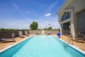 Seasonal outdoor pool, open 9 AM to 10 PM, pool loungers