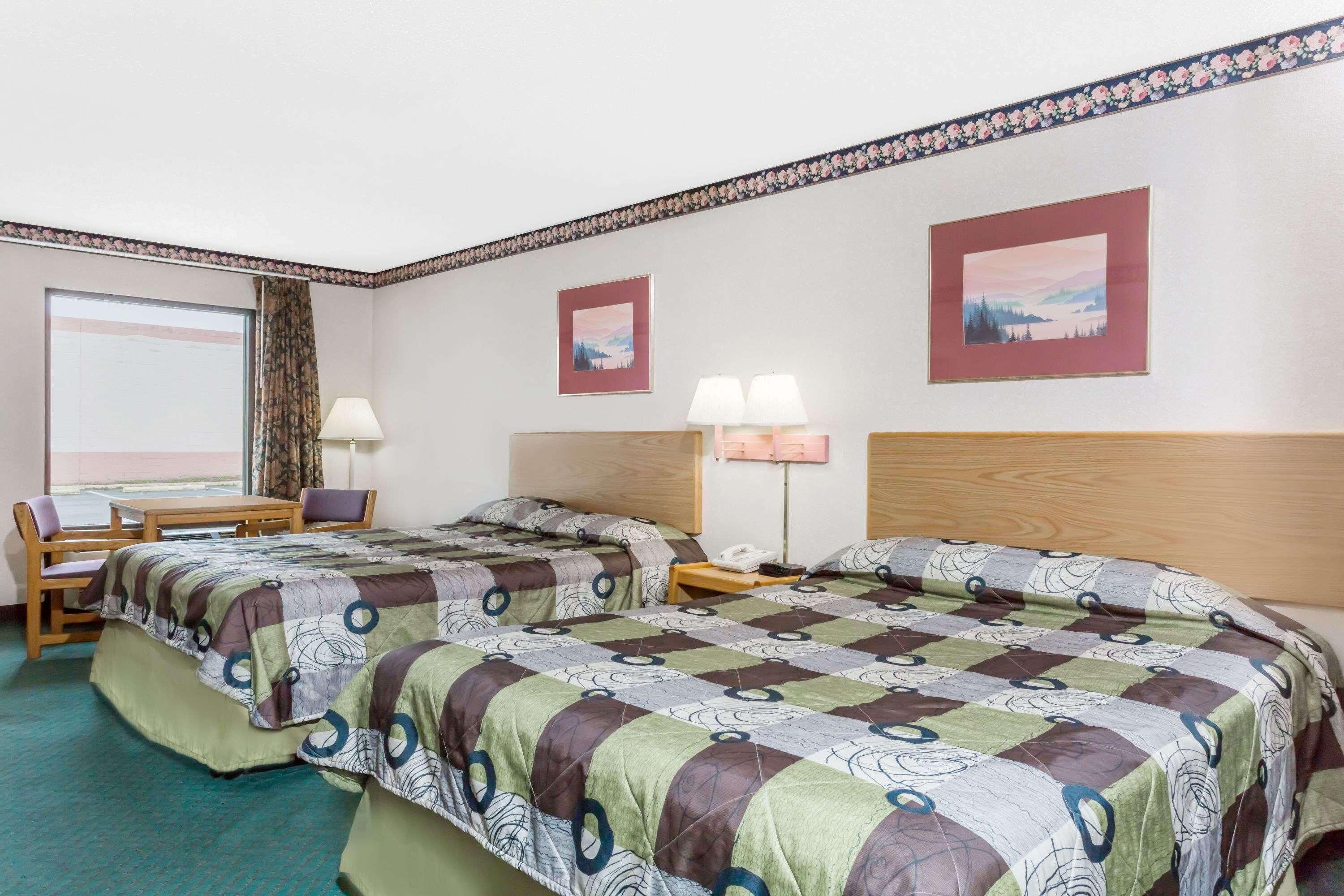 Premium bedding, down comforters, desk, laptop workspace