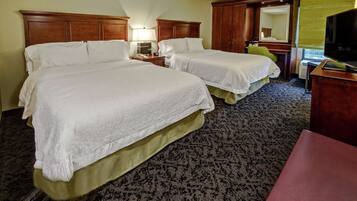 Hypo-allergenic bedding, desk, laptop workspace, blackout curtains