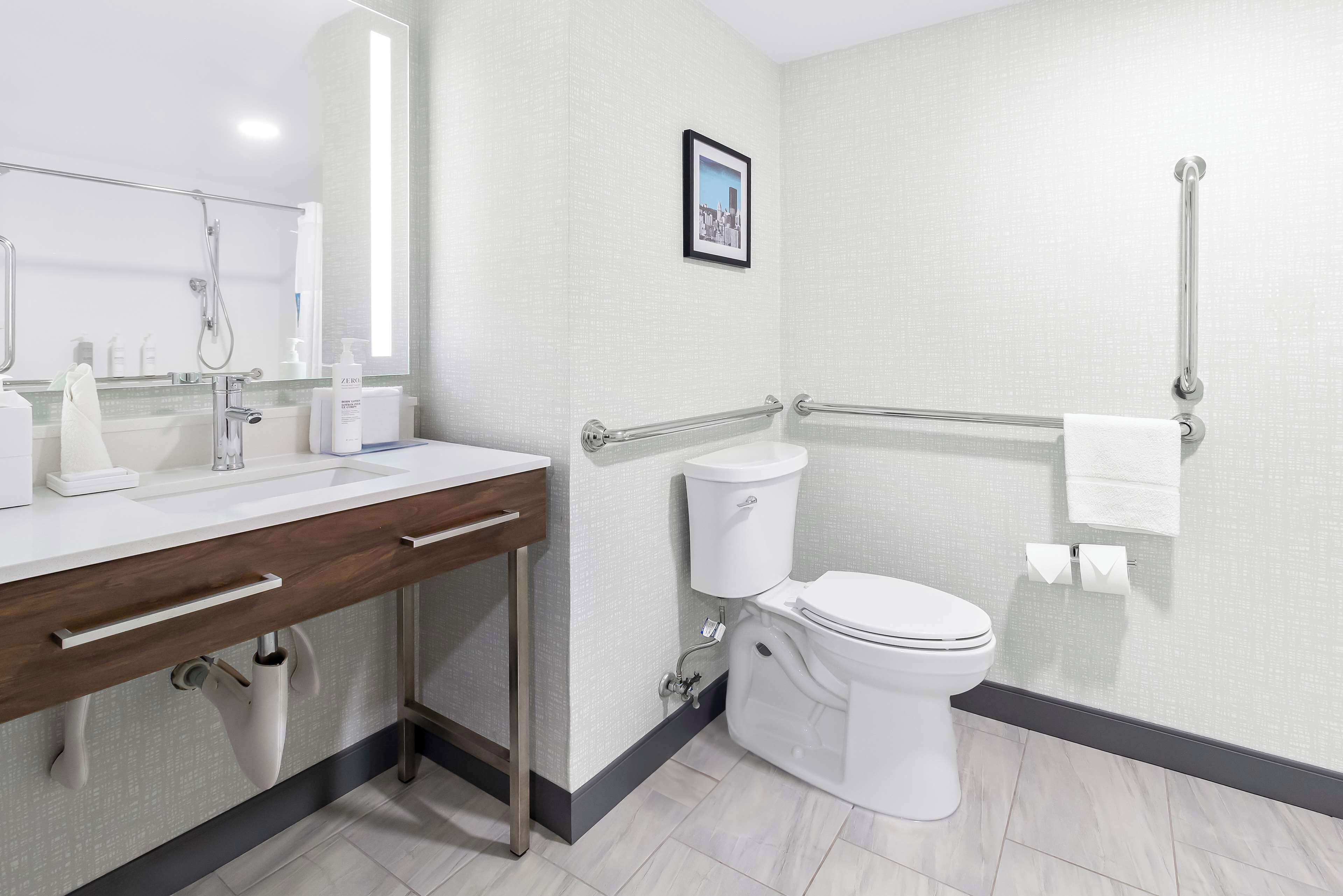 designer toiletries, hair dryer, towels