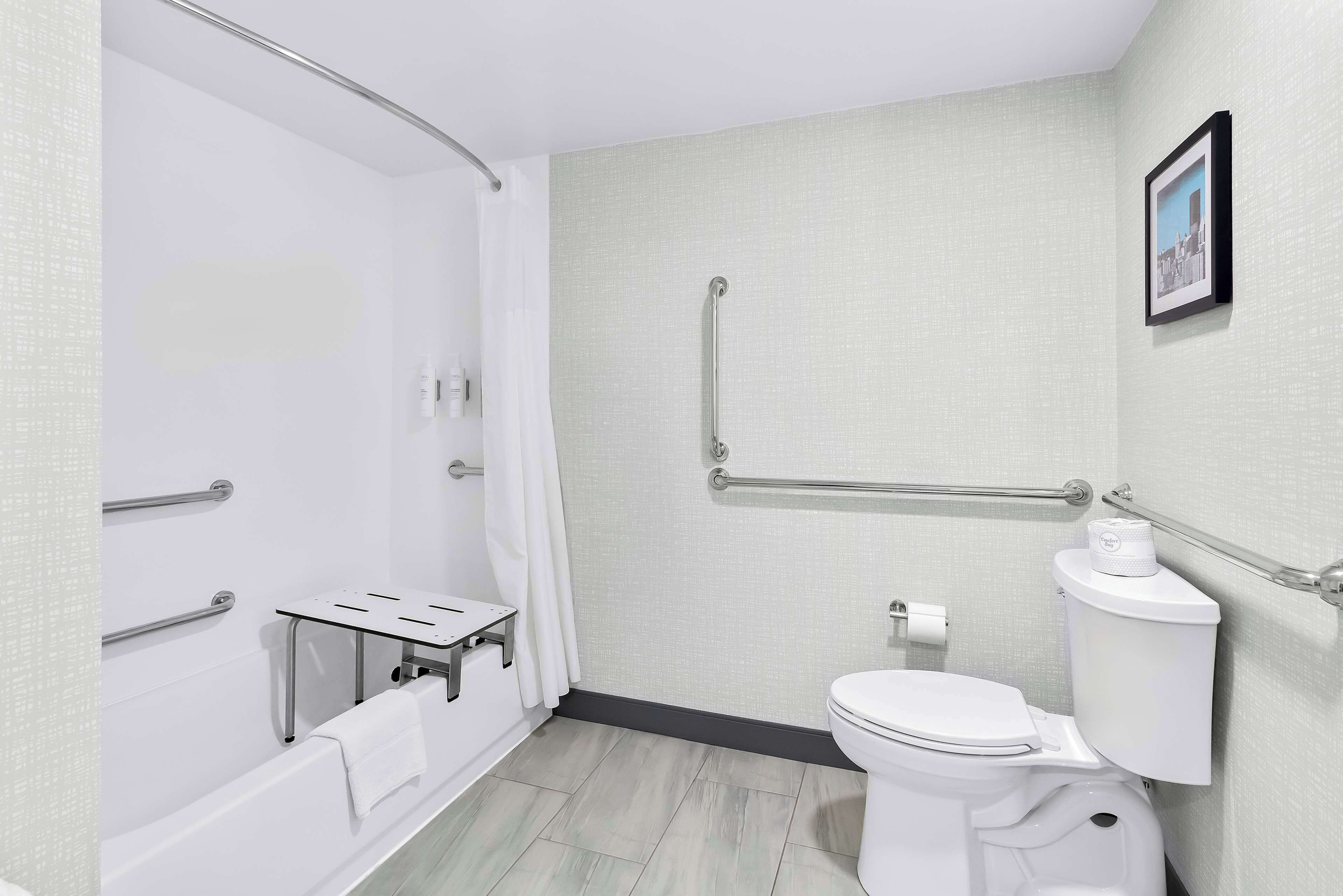 designer toiletries, hair dryer, towels