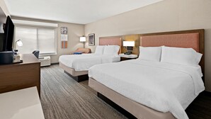 A hotel room with two beds, a desk, a chair, a lamp, and a window with blinds. - Hampton Inn Provo (Provo)
