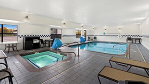 A pool area with two pools, lounge chairs, and a covered seating area. - Hampton Inn Provo (Provo)