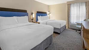 A hotel room with two beds, a desk, a chair, a lamp, and a window with curtains. - Hampton Inn & Suites Nashville/Franklin (Cool Springs) (Franklin)