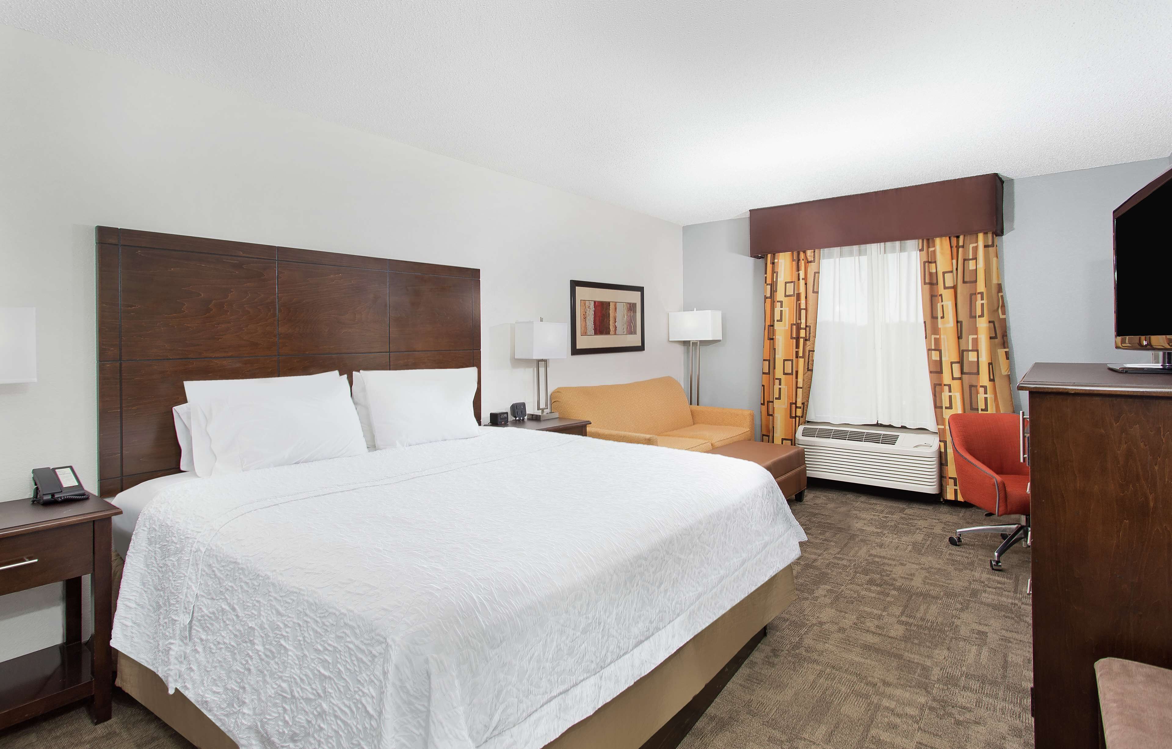 desk, laptop workspace, blackout curtains, iron/ironing board