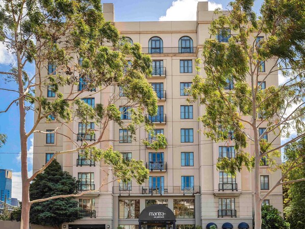 A multi-story hotel with a classic architectural style, featuring balconies and large windows. - Mantra on Jolimont Melbourne (East Melbourne)