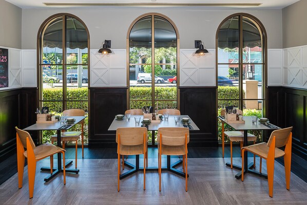 Enjoy meals in this elegant dining area with a long table and six comfortable chairs.