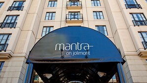 A hotel entrance with a sign reading "mantra on jolimont." - Mantra on Jolimont Melbourne (East Melbourne)