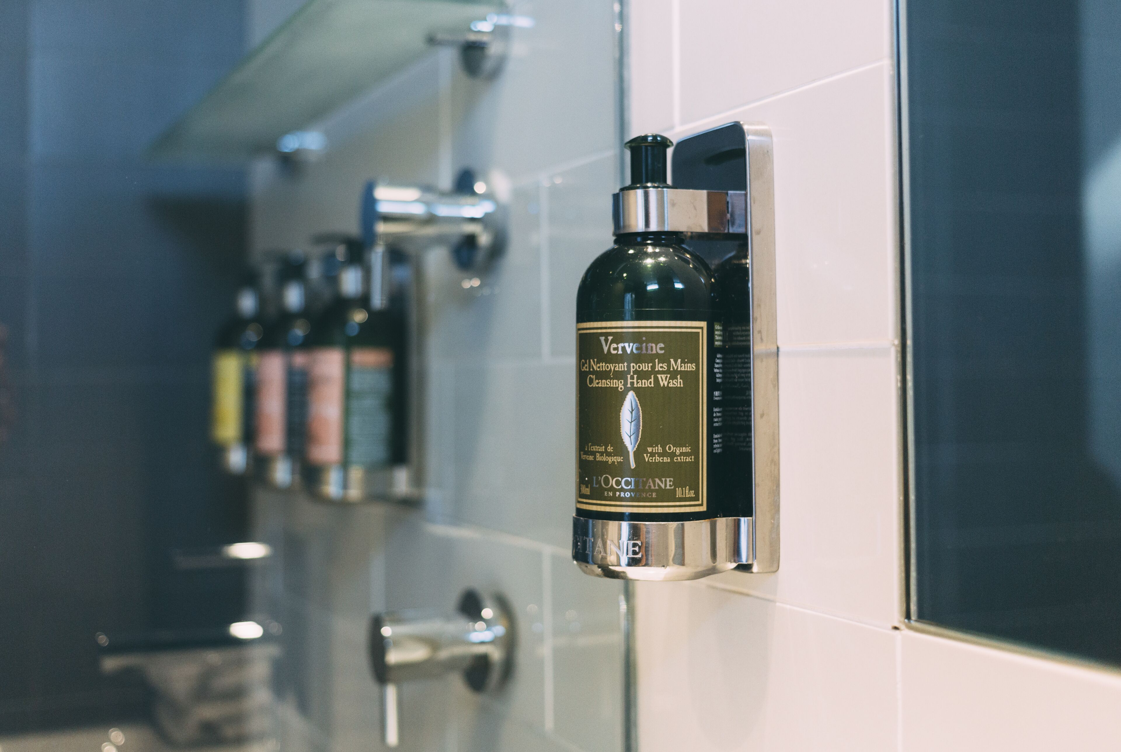 shower, designer toiletries, hair dryer, towels