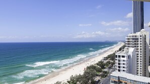 A coastal cityscape with a beach, high-rise buildings, and a clear sky. - Breakfree Imperial Surf (Surfers Paradise)