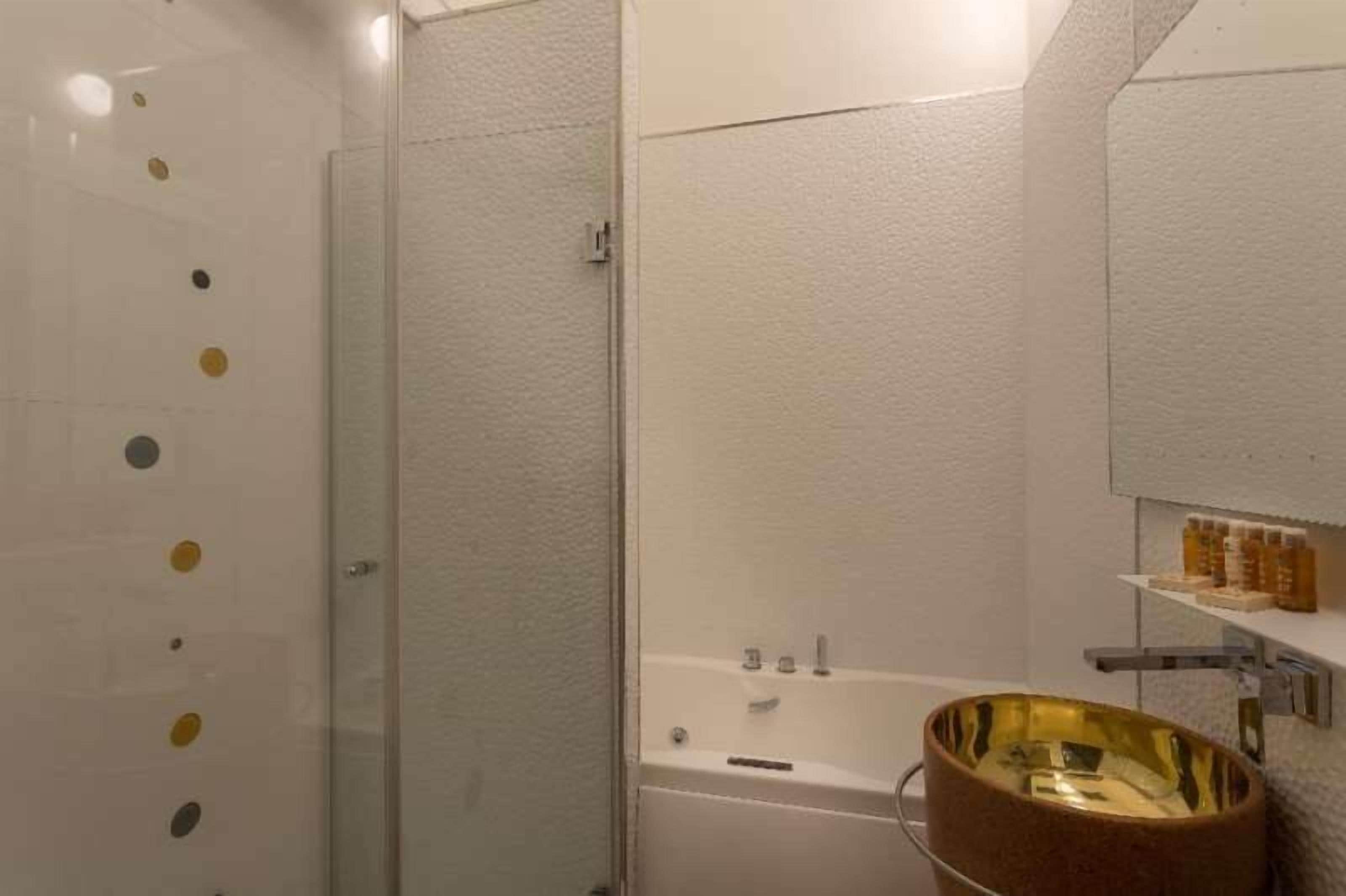 designer toiletries, hair dryer, towels, soap