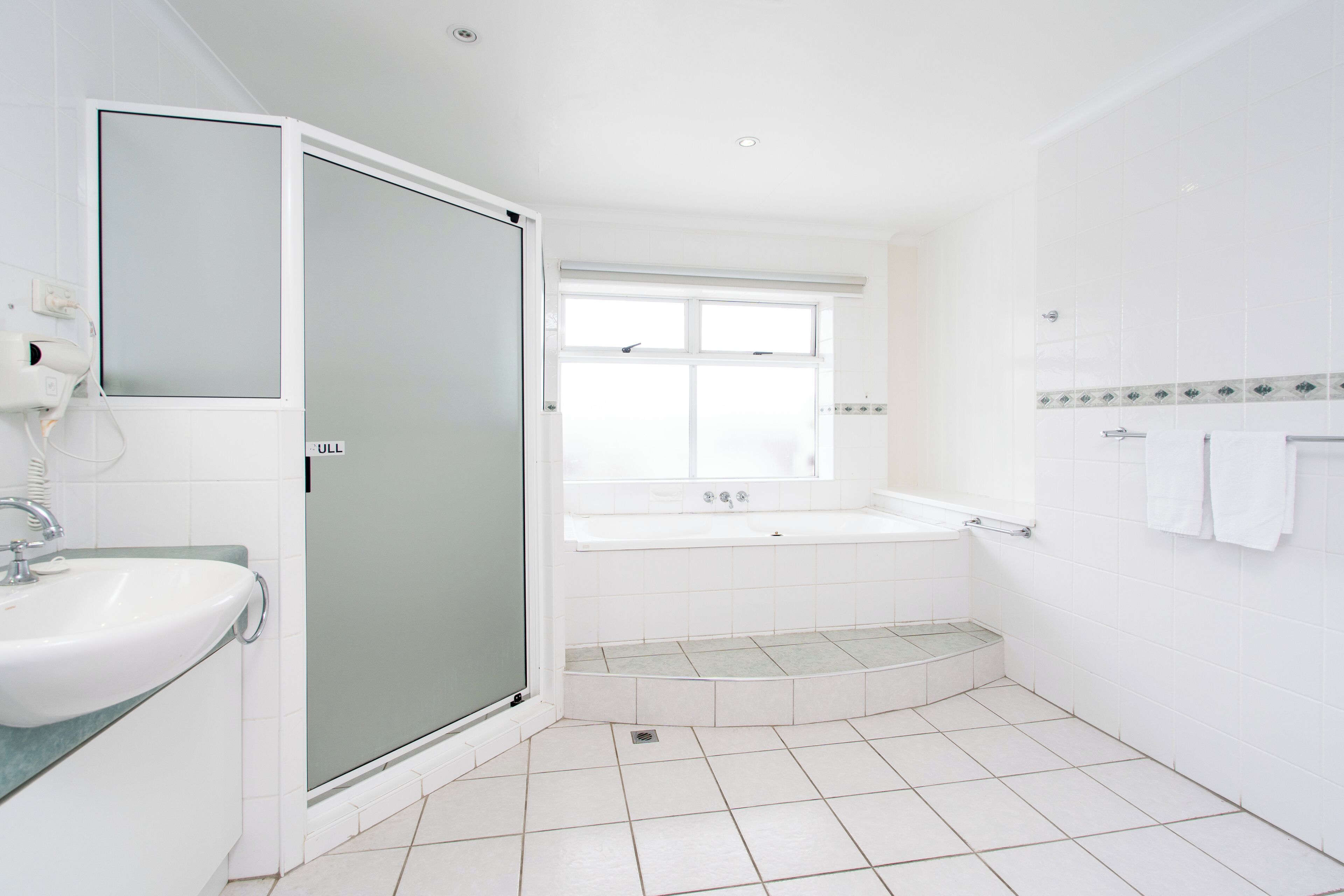 deluxe spa room | bathroom | free toiletries, hair dryer, bathrobes, towels